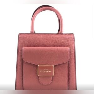 Coach Mini Pepper Crossbody bag. Made from pebble leather. Style C6779 pink hue